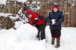 boys building a snowman
